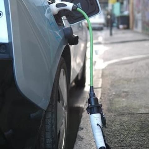 Adapter being used to charge a Type 2 socket EV.